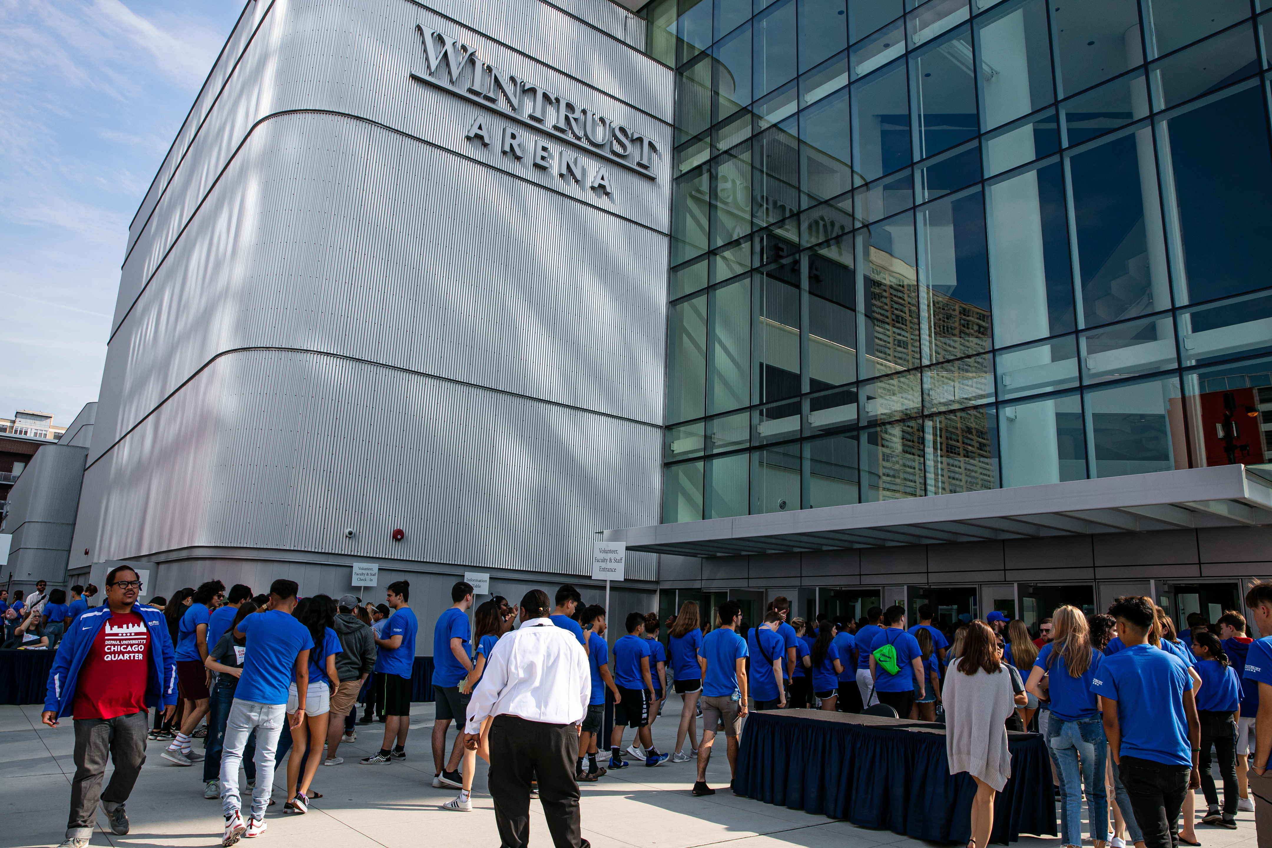 New DePaul students, faculty and staff in Discover and Explore Chicago classes, and faculty, staff and student volunteers file into Wintrust Arena for the new student convocation, Tuesday, Sept. 10th, 2019. (DePaul University/Randall Spriggs)